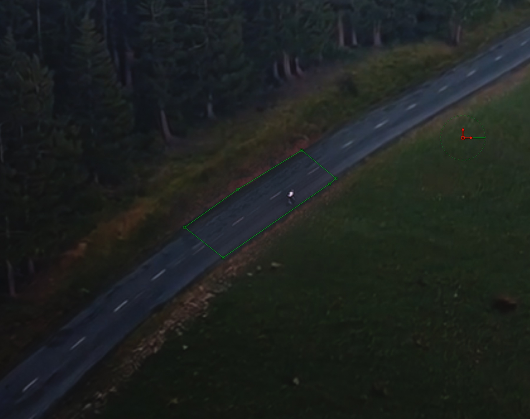 Fusion polygon mask traced around the cyclist plus a long slice of road on either side.